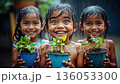Three children holding potted plants in the rain 136053300