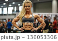 A female bodybuilde posing for a picture in a gym 136053306