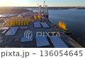 Norfolk offshore wind terminal with turbine blades and jack-up vessel 136054645