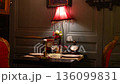 Romantic table for two with red velvet chairs in vintage restaurant 136099831