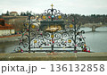 Bronze relief lectern of Saint John of Nepomuk on Charles bridge in Prague love locks Czech Republic most visited landmarks and tourist spot, symbol of the holy confession thrown drowned in the Vltava 136132858