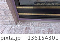 Close-up video showing textured brick pattern around a fireplace. The camera focuses on the horizontal alignment and color variation of the brick. 136154301