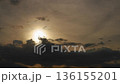 Timelapse of clouds in the sky against the background of the sun. High quality 4k footage 136155201