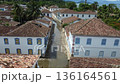 Aerial view of typical flooded street between Paratys colonial style houses 136164561