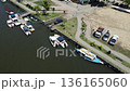 Small motor boats moored and launched along a river in Paraty, Brazil 136165060