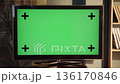 Modern television displaying a customizable green screen with tracking markers, offering a versatile mockup for content creation and advertising in a home entertainment setting 136170846