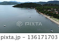Motorised Paraglider flying along the Jabaquara Beach in Paraty, Brazil 136171703