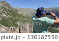 man making picture panorama mountains amateur mobile phone 136187550