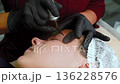 Tattoo artist doing permanent makeup. make-up artist doing make-up girl in the salon, beauty concept. The make-up artist does Long-lasting styling of the eyebrows of the eyebrows 136228576