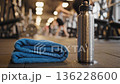 close up of sweat towel and water bottle with subtle 136228600