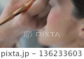 Professional Makeup Application Applying Cosmetic Blush To Woman's Cheek 136233603