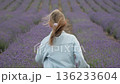Girl running lavender field, child enjoys freedom in beautiful summer nature 136233604