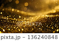 A video background of wavy glitter and particles with golden light falling on a luxurious black background 136240848