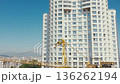 Skyscraper building construction crane lifting materials 136262194