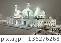 Majestic white mosque illuminated at night on a snow-covered square 136276268