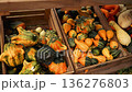 Red pumpkins display in wooden crates at farm market 136276803