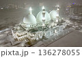 Majestic white mosque illuminated at night on a snow-covered square 136278055