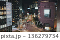 A vibrant urban night scene captures the continuous flow of traffic along a bustling city street with bright lights and towering buildings. Time-lapse, Seoul, South Korea 136279734
