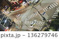An urban intersection scene captures the flow of traffic and pedestrians as lights change, vehicles navigate, and people cross the street. Time-lapse, Seoul, South Korea 136279746