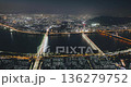Aerial perspective captures a bustling city at night with bright lights reflecting on the water and bridges linking urban sections. Time-lapse, Seoul, South Korea 136279752
