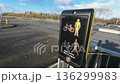 Pedestrian and bicycle crossing button on a roadside in urban area 136299983
