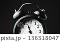 Vintage alarm clock. Clock face on black background. 136318047