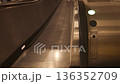 Close-up view of an empty escalator moving upward in an underground passage or office building. Modern public infrastructure, transportation concept, urban interior, motion and direction. No people 136352709
