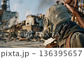 Post-apocalyptic landscape with figure wearing gas mask near ruined buildings in industrial area 136395657