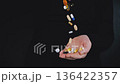 Adult Woman Pouring Pills into Palm Health Supplement Concept 136422357
