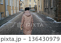 Walking along a quiet cobblestone street in winter in a historic town 136430979