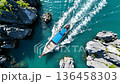 Aerial view of Thai boats dangerous ride between cliffs  136458303