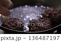 Cooking homemade cutlets in a frying pan 136487197