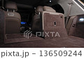 The rear seat of the car folds down.  136509244