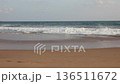 A public beach in Sri Lanka, Hikkaduwa. Beautiful view of the Indian Ocean at sunset. South Asia. Handheld, slow motion. Wide shot, selective focus. 136511672