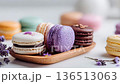 Lavender Infused Macarons Arranged on Wooden Platter 136513063