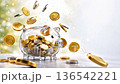 Transparent piggy bank with coins falling | Business background for asset formation, investment, and savings (high resolution, copy space available) 136542221