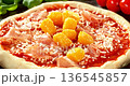 Super slow motion closeup of fresh pineapple pieces falling onto prepared Hawaiian pizza. Raw dough with tomato sauce, mozzarella and ham surrounded by ingredients. Concept of pizza preparation. 136545857