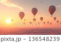Barren land awakens as hot air balloons rise with the sun 136548239