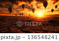 Barren land awakens as hot air balloons rise with the sun 136548241