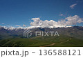 Elbrus Region. Flying over a highland plateau. Beautiful landscape of nature. Mount Elbrus is visible in the background. 136588121
