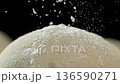 The dough on the kitchen table with falling flour . Filmed on a high-speed cinema camera at 1000 fps 136590271