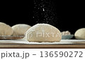 The dough on the kitchen table with falling flour . Filmed on a high-speed cinema camera at 1000 fps 136590272