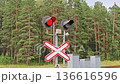 Red traffic light signal at railway crossing. traffic light at the railway crossing is red 136616596