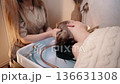 A woman relaxes at a Japanese spa. 136631308