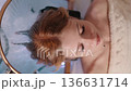 A woman relaxes at a Japanese spa. 136631714