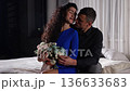 Couple Sharing Warm Intimate Evening, Two Lovers Relax Together In Comfortable And Loving Atmosphere, Romantic Partners Unwind And Share Tender Moments In Their Cozy Bedroom Sanctuary 136633683