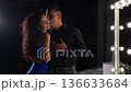 Couples Exchange Affection, Passion Ignites Beneath Bright Illumination, Two Lovers Experience Deep Connection Through Gentle Kiss Amidst Colorful Surroundings And Bright Lamps 136633684
