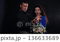 Surprise Engagement Amid Dramatic Lighting, Romantic Moment Captured During Emotional Proposal Scene, Joyful Couple Shares Heartfelt Engagement In Beautifully Lit Dark Studio Setting 136633689