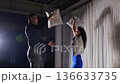 Vibrant Dance Scene, Lively Celebration With Dynamic Movements And Cheerful Atmosphere, Playful Chaos Of Dancing Couple Leaping And Spinning Under Bright Lights With Upbeat Energy 136633735