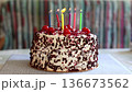 Black Forest cake with cherries, chocolate chips and whipped cream. Birthday cake, blowing out candles. Shvartsvald cherry cake, a traditional German pastry. Selective focus, close-up. 136673562